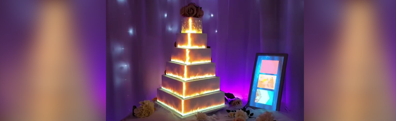 couples project moving video images onto their wedding cakes