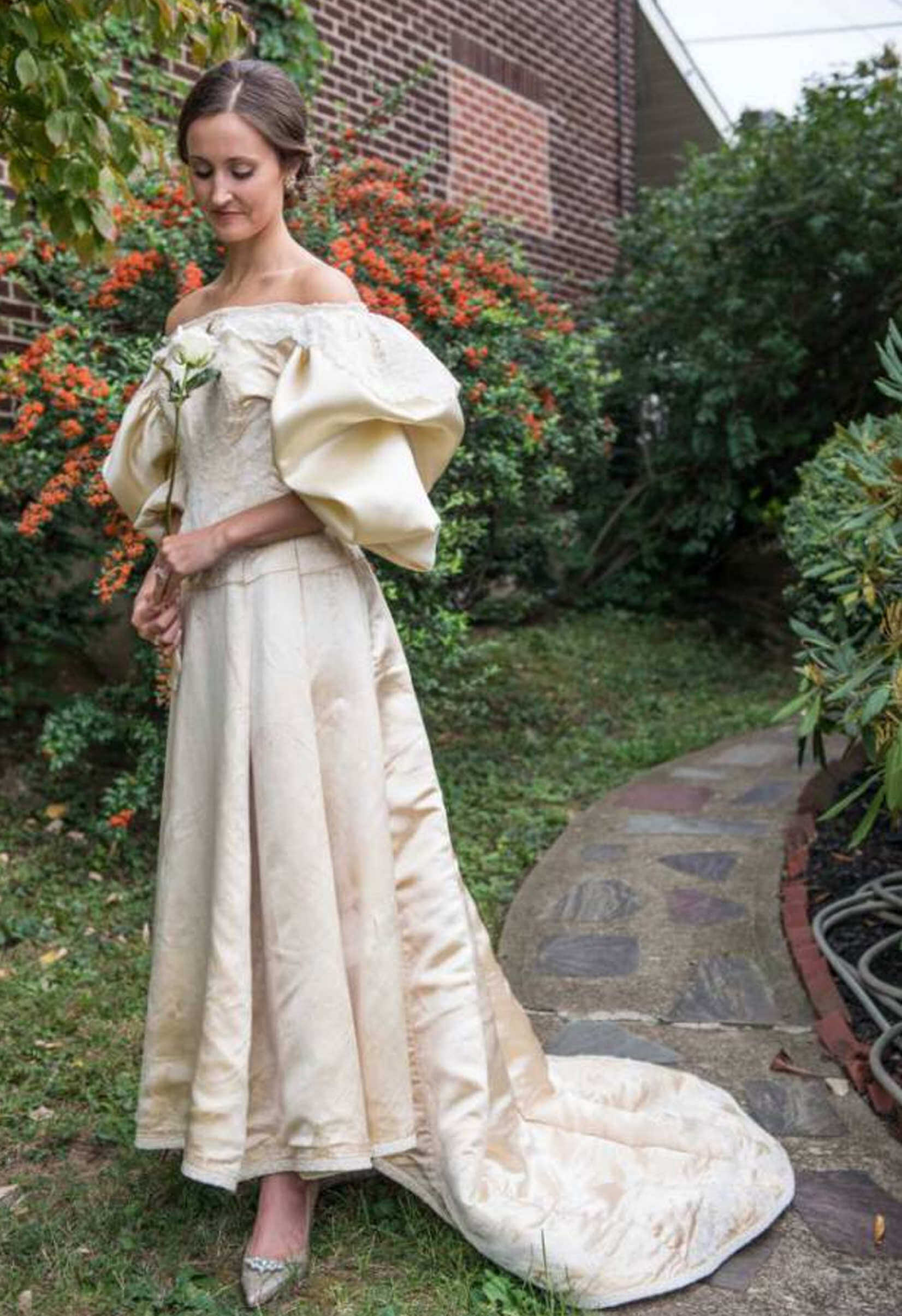 Abigail strikes a pose in her restored second hand wedding dress