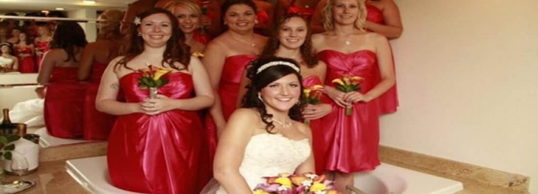 bridesmaids pose in a hot tub